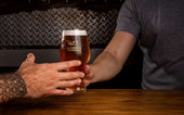 bartending grabbing pint glass photo by gonzalo acuna
