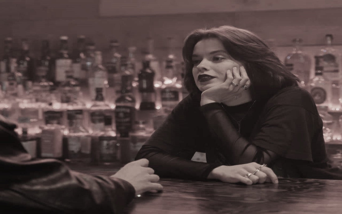 A Female Bartender Talking to a Customer photo by cottonbro studio