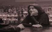 A Female Bartender Talking to a Customer photo by cottonbro studio