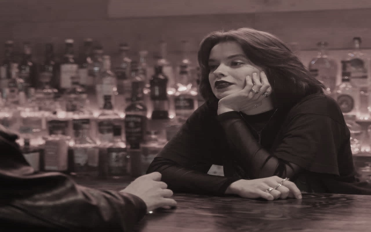 A Female Bartender Talking to a Customer photo by cottonbro studio